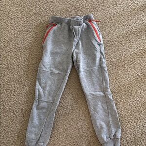 Mini Boden Gray Kids Jogger Pants with Red Accents.